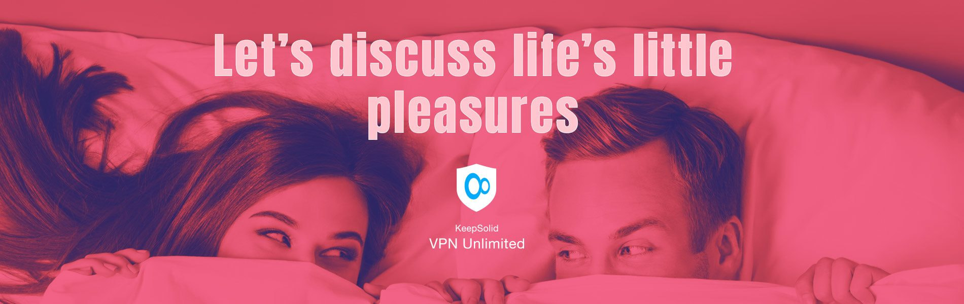 Young attractive playfull couple peeping from bedsheet on the bed at bedroom learning how to watch porn safely with KeepSolid VPN Unlimited